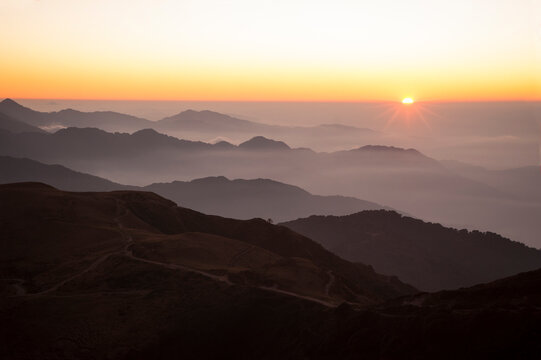 Sun rising up in mountains, Indian Himalayas © aksammit