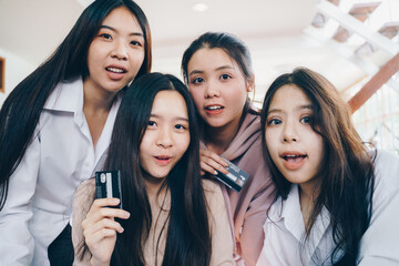 Group of women friend holding credit card feel wowo for online shopping