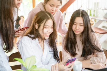 Business designers women analyzing data using computer brainstorming meeting