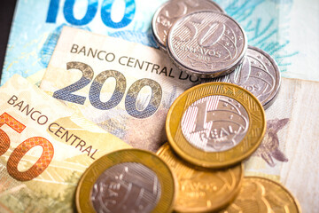 In this photo illustration the detail of the two hundred reais note and a few real coins,...