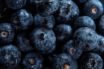 Fresh natural antioxidant blueberries pile, macro detailed close up © Georgii