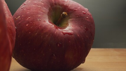 Macro footage in motion of some apples on the table
