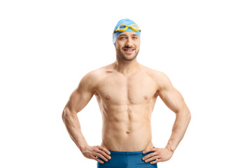 Male swimmer with googles and a cap posing