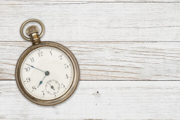 Old time mockup with a pocket watch on weathered wood