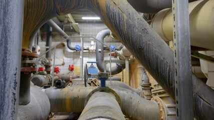 Fototapeta na wymiar Boiler room full of pipes sliding movement motion