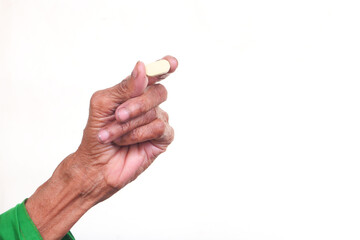 elderly women hand holding pills with copy space 