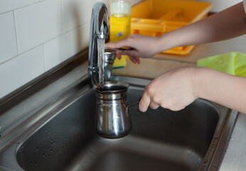girl preparing coffee in the kitchen