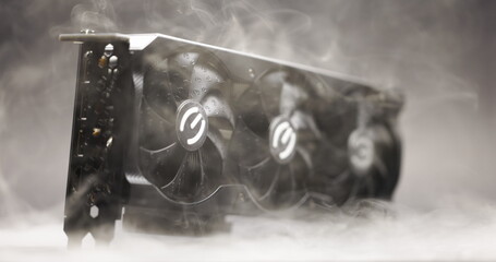Graphics card with smoke rising and dark background