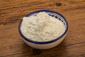 Wheat flour heap in the bowl