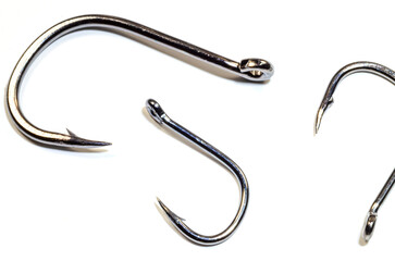 Image of steel fishing hooks on a white background. Isolated