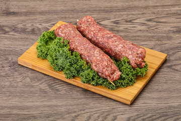 Raw minced beef kebab skewer