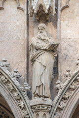 Religious scenes in wall sculptures of Votive Church in the historical and touristic downtown in Vienna, Austria