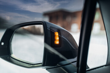 Modern car rear view mirror with drive assistance sensor. 