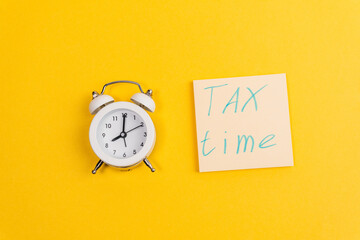 Tax time flat lay composition on yellow background. copy space