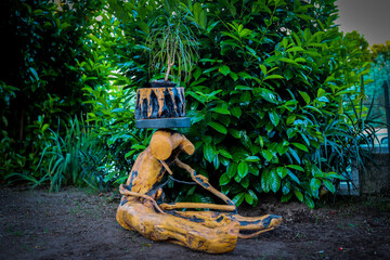 example of handicrafts made of rustic wood by a craftsman to effect the garden and outdoor areas. Sustainable craftsmanship with reusable wood