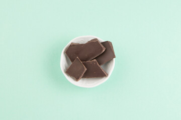 Chocolate bars in plate top view shot
