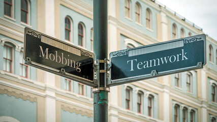 Street Sign to Teamwork versus Mobbing