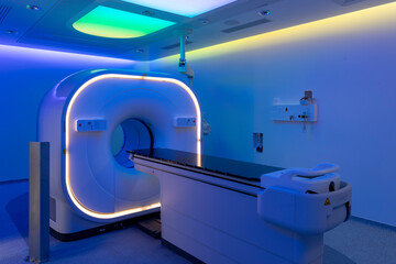 view of a scanner room bathed in blue light