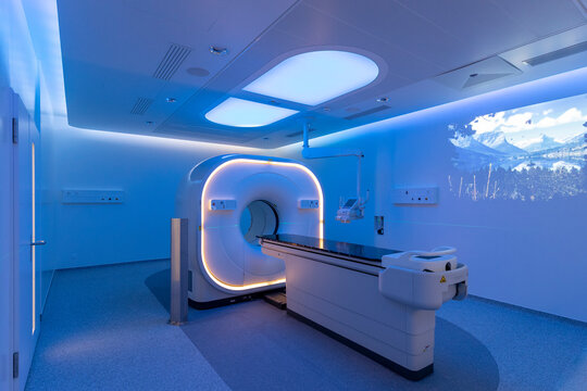 view of a scanner room bathed in blue light