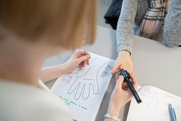 an occupational therapist working with a patient