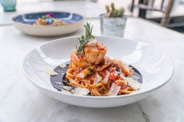 Spaghetti with prawns, sea scallops and parmesan