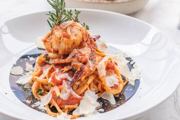 Spaghetti with prawns, sea scallops and parmesan