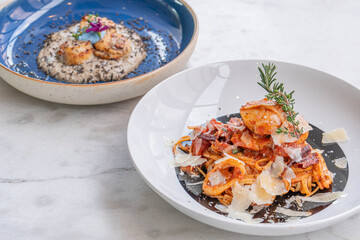 Spaghetti with prawns, sea scallops and parmesan