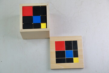 Montessori binomial and trinomial cubes 