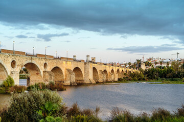 Fototapeta na wymiar Medieval Palmas Bridge over Guadiana River in Badajoz, Spain