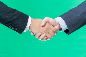 Business handshake on green screen background, partnership trust, respect sign
