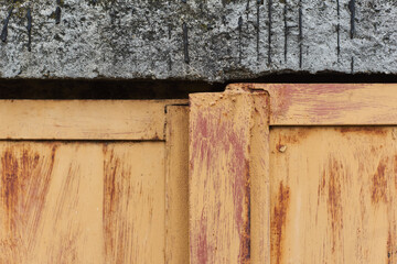 Plate of metal rusty texture with traces of yellow paint faint color corroded with age in Sofia,...