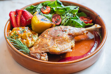 Hot fried chicken legs with grilled pineapple and Strawberry,Tomato with vegetable