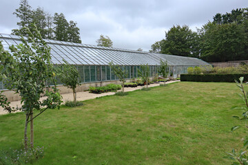 A large greenhouse in the kitchen garden of an English country house