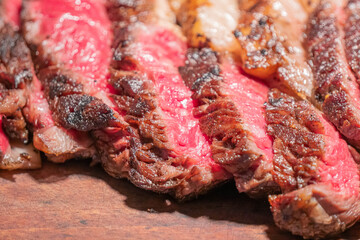 Dry-aged marble beef steak Tomahawk on wooden board with spices. Close-up, dinner concept.