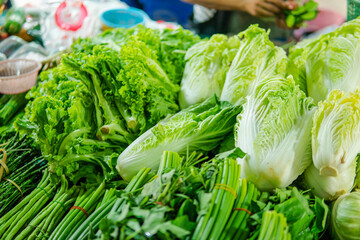 A stall in a market selling assorted vegetables including