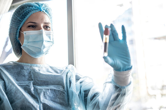 Medical doctor or laborant holding tube with nCoV Coronavirus vaccine for 2019-nCoV virus.