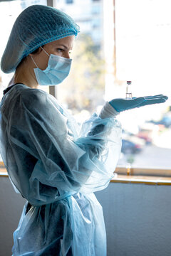 Medical doctor or laborant holding tube with nCoV Coronavirus vaccine for 2019-nCoV virus.