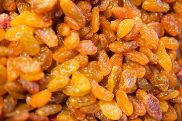 dried grapes, dark raisins in bowl,