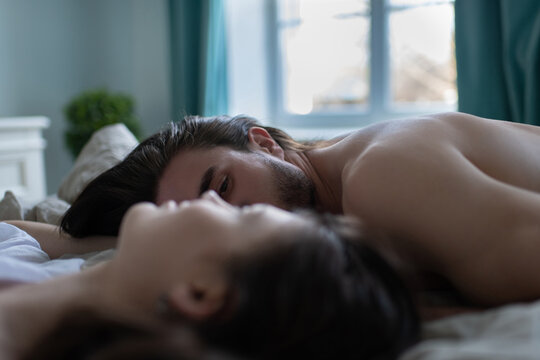 Portrait Of Husband And Wife Lying On The Pillow
