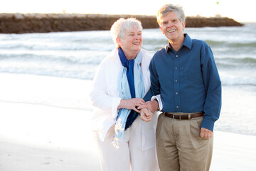 Married couple in their Seventies showing affection at Cold Storage Beach on Cape Cod