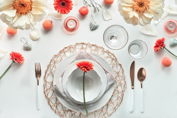 Effortless golden birthday dinner table decor. White dinner table, white and gold utensils,...