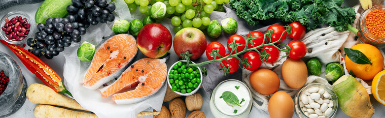 Selection of organic healthy products on gray background product.