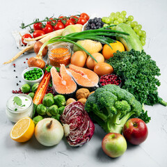 Selection of organic healthy products on gray background product.