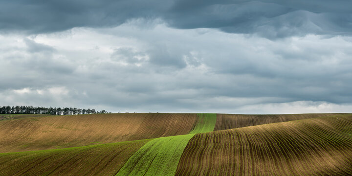 Panoramic view of rolling fields near Kyjov with dramatic cloudy sky, Hodonin District, South Moravian Region, Moravia, Czech Republic