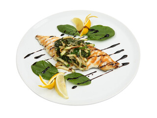 Grilled seafood dorado fish with lemon and vegetables on white round plate