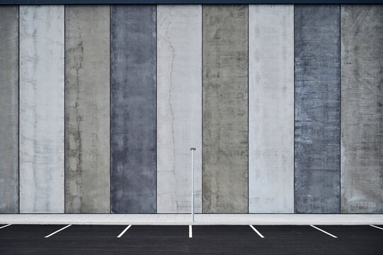 Empty parking lots near wall with striped pattern
