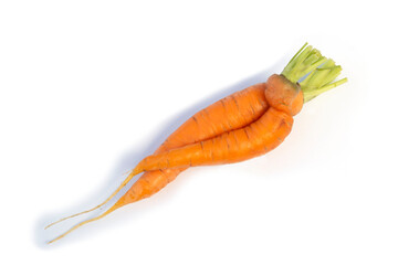 carrots in funny shapes on white background.