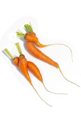 carrots in funny shapes on white background.