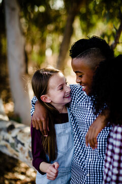 Close Up of Siblings Embracing at Park in Chula Vista