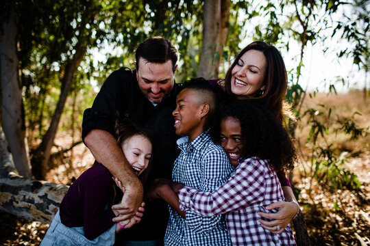Family of Five Hugging & Laughing at Park in Chula Vista